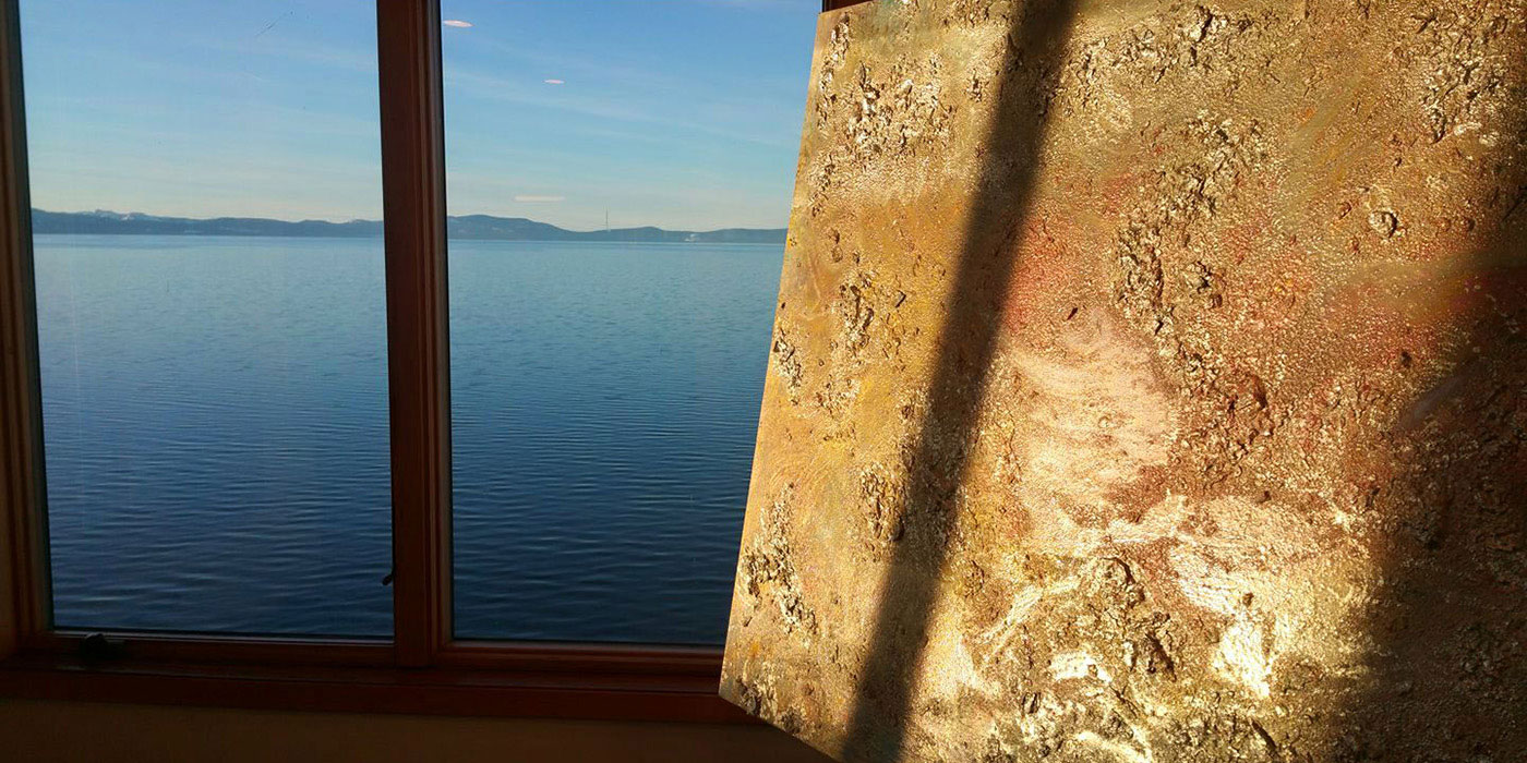 Gold painting over lake tahoe