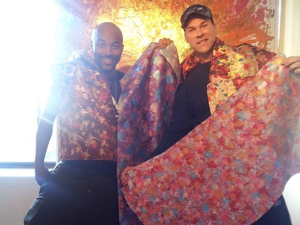 designers scott forrest and eric jenkins draped in bowtie fabric